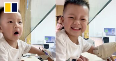 Brave Chinese boy smiles through pain while getting blood drawn