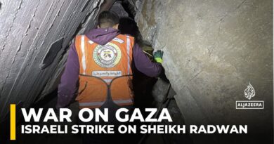 Rescue workers search for survivors after an Israeli attack on Gaza City’s Sheikh Radwan