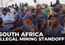 South Africa mining standoff: Reports say 700 held underground by criminal gangs