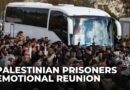 Palestinian prisoners start coming off bus in Ramallah