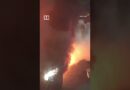 Car catches fire at petrol station in China, worker and driver fight blaze #shorts