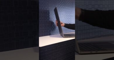 Lenovo demos a foldable laptop screen that bends for dual-sided, tablet, or a tall 18″ display mode.