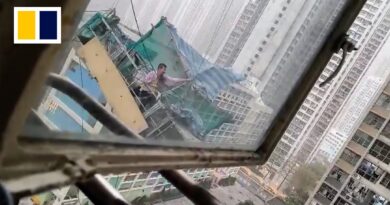 Narrow escape for Hong Kong construction worker as platform stars swinging in strong winds