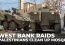 Palestinians clean up mosque after Israeli troops set it on fire during West Bank raids